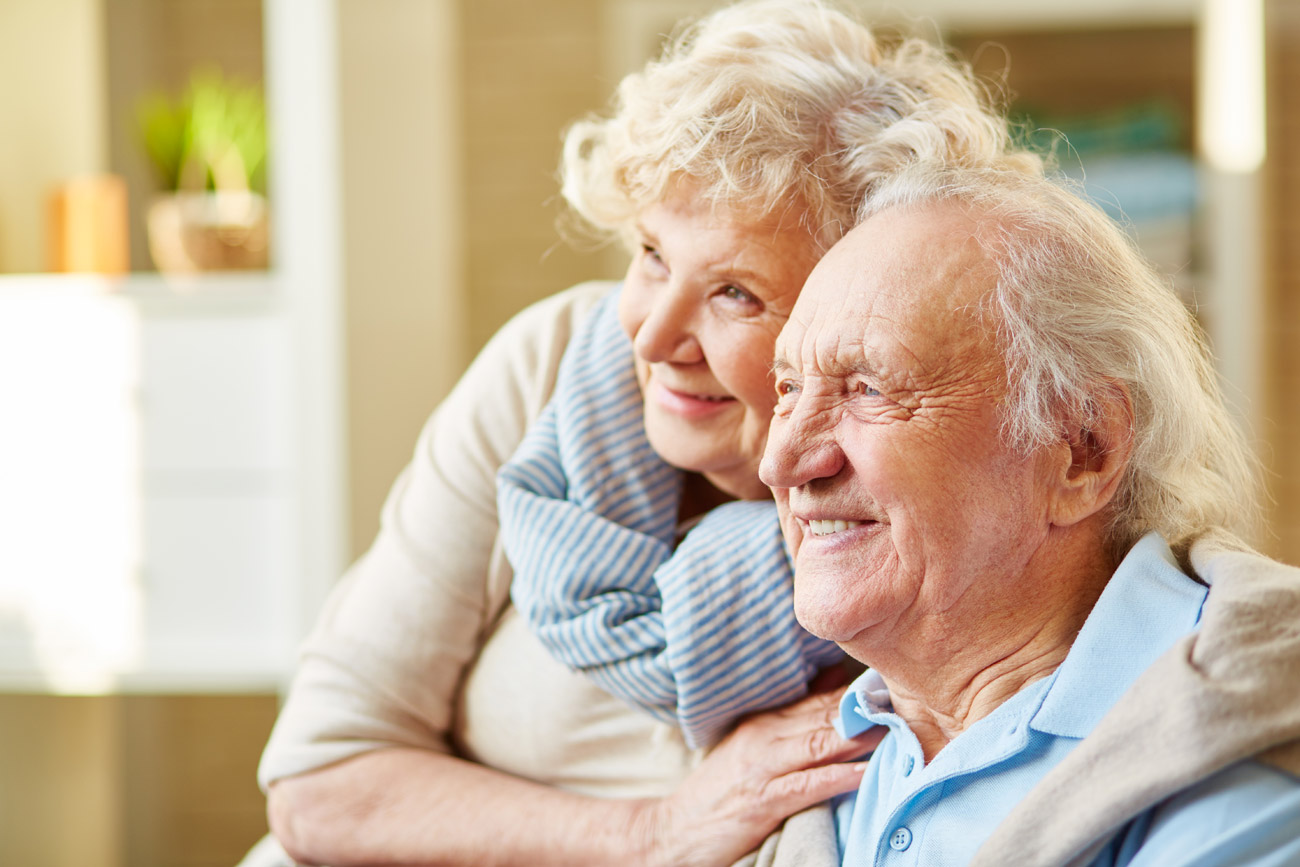 Smiling older couple at home
