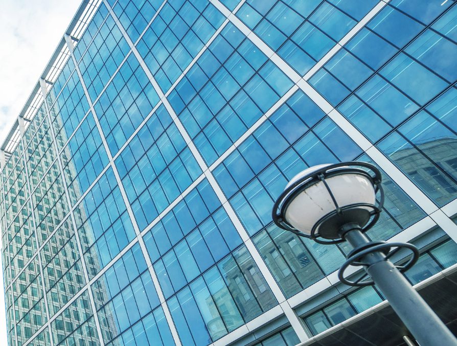 Glass office towers seen from street level